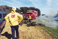 An SBI employee overseeing a controlled burn